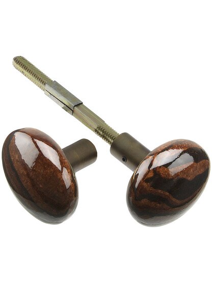 Pair of Bennington Style Door Knobs With Brass Shanks in Antique Brass.
